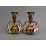 A Pair of Crown Derby Imari Vases of Bottle Form with Flared Neck Having Twin Mask Head Handles, (