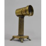 A Late 19th Century Brass Magic Lantern Lens with Operating Aperture, Mounted on Ribbed Column