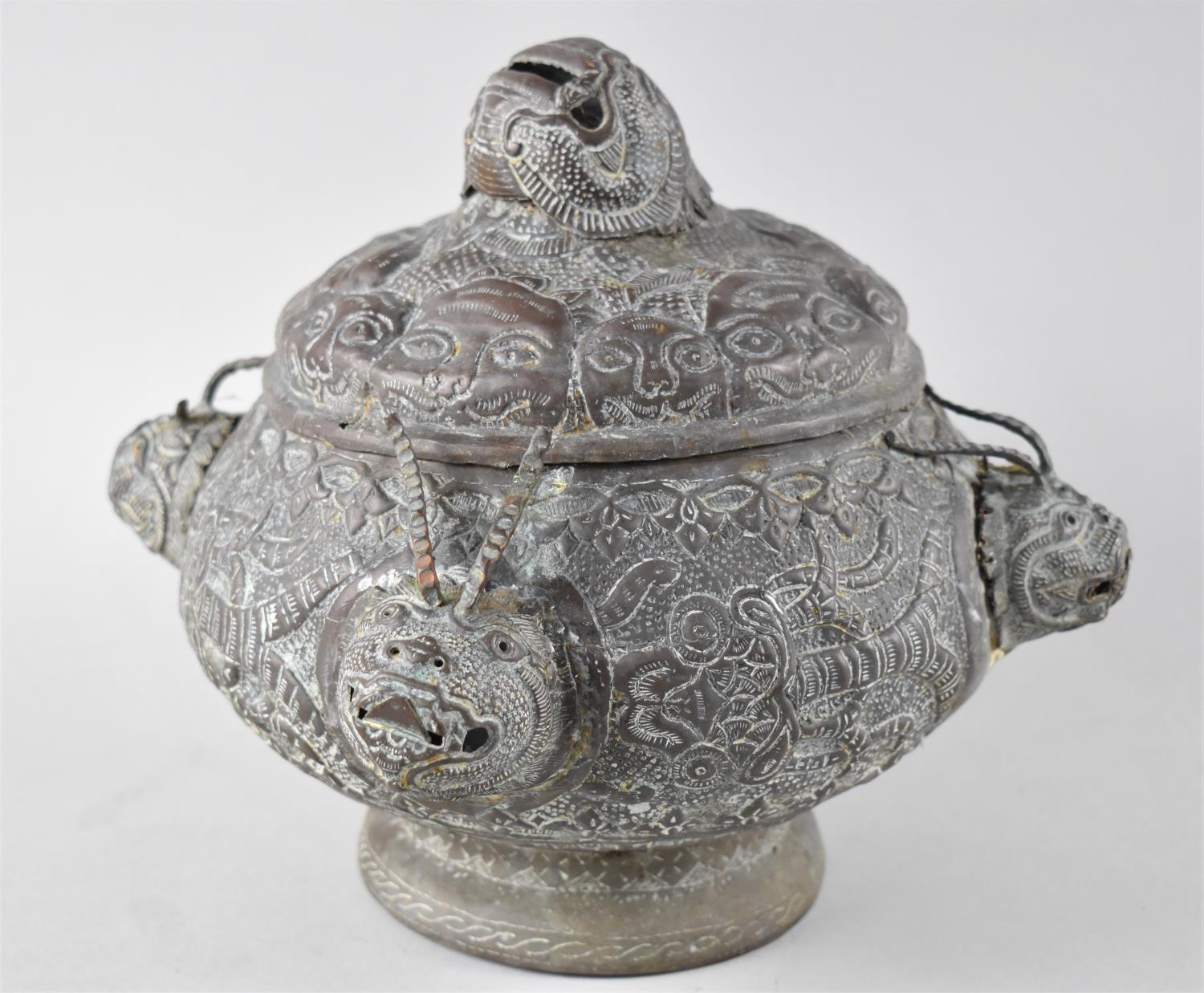 An Oriental Bronze Censer of Compressed Globular Form Having Four Horned Masks to Body and Larger