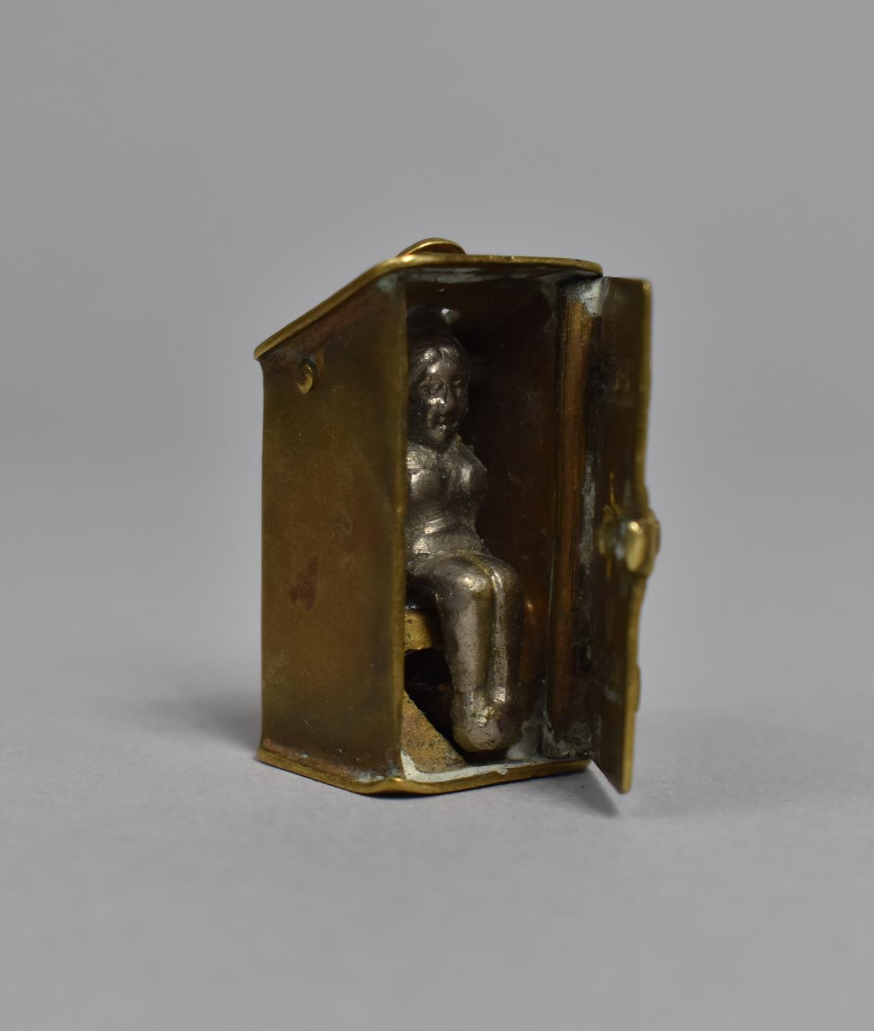 A Late 19th/Early 20th Century Novelty Cheroot Cutter Fob in the form of Nude Lady in Outhouse,