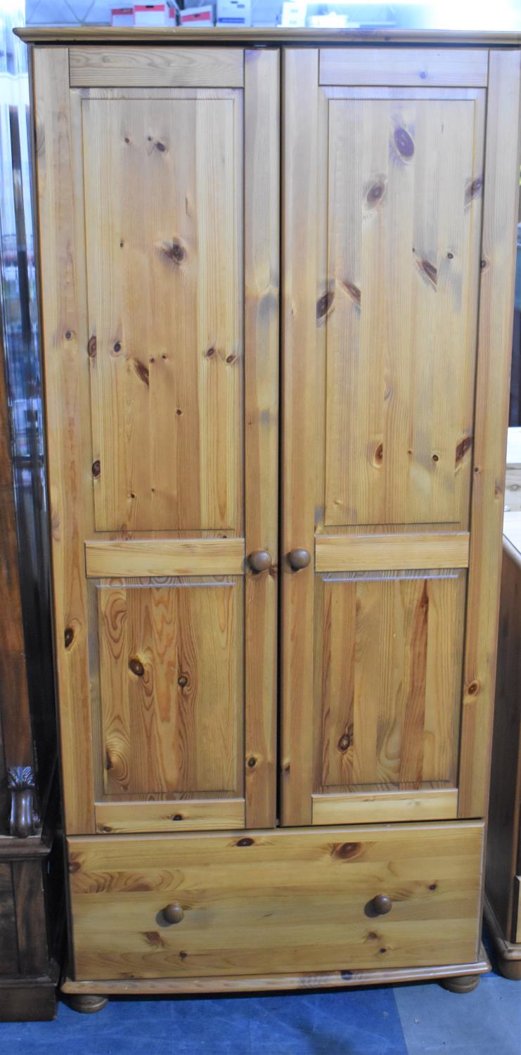 A Modern Pine Double Wardrobe with Base Drawer, 87cm wide