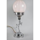 An Art Deco Influenced Chromed Table Lamp, The Supports in the Form of Dancing Nude with Knee