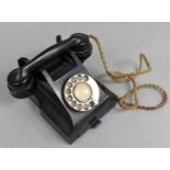 A Vintage Black Bakelite Telephone with Base Drawer