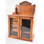 A Edwardian Oak Smokers Cabinet with Glazed Door to fitted Interior, Glazed Galleried Back, 28cms