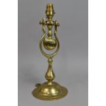 A Free Standing/Wall Hanging Brass Gimballed Light Fitting on Circular Stepped Base, 34cms High