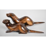 Two Carved Wooden Otters by Stuart Rogers, Appledore, Largest 31cms