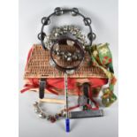 A Wicker Basket Containing Tambourine and other Percussion Instruments