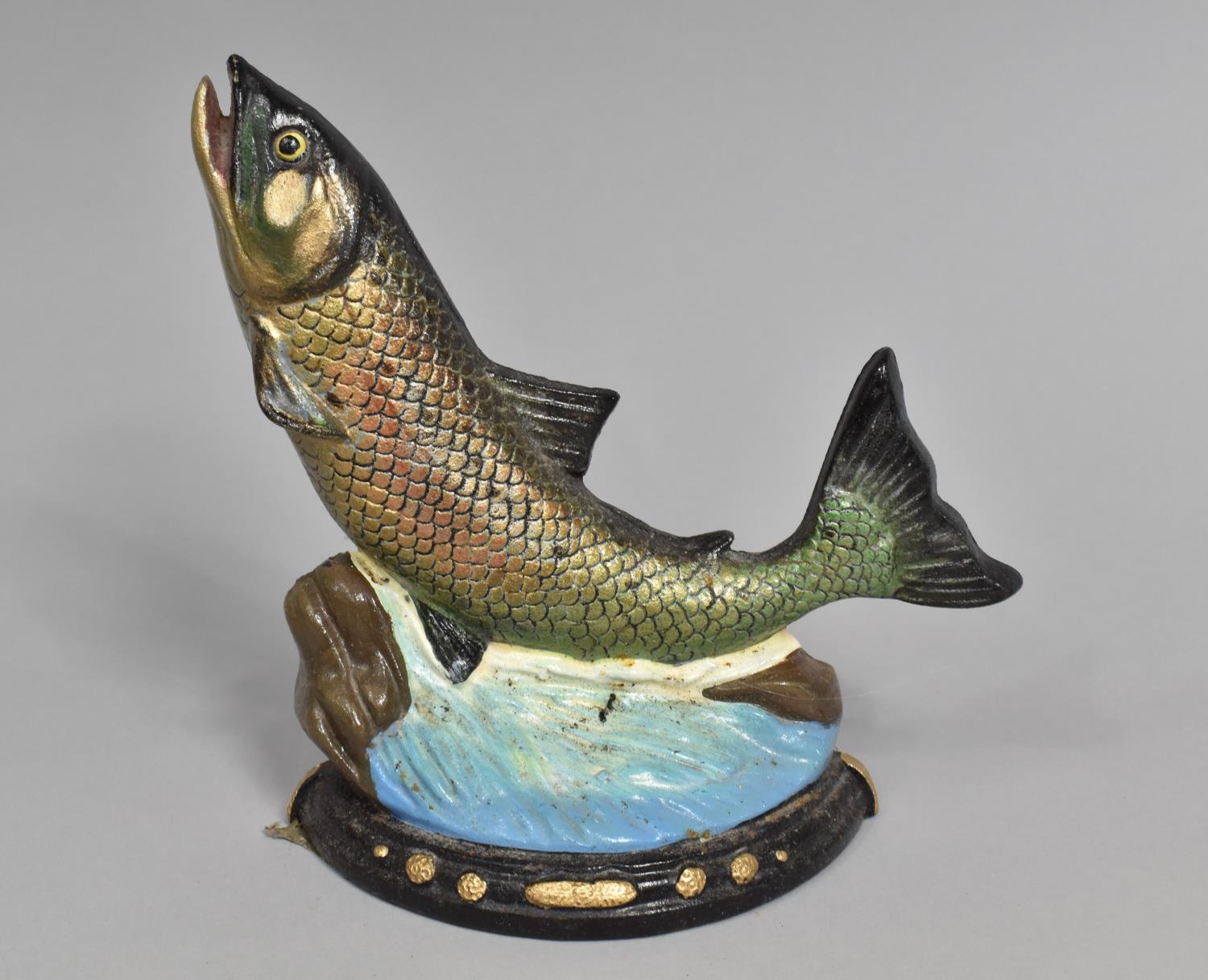 A Modern Painted Cast Iron Doorstop in the Form of a Salmon Leaping, 21cms high