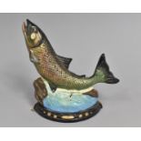 A Modern Painted Cast Iron Doorstop in the Form of a Salmon Leaping, 21cms high