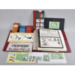 A Ring Binder Containing World Cup Stamps fo The World together with Cigarette Cards Etc