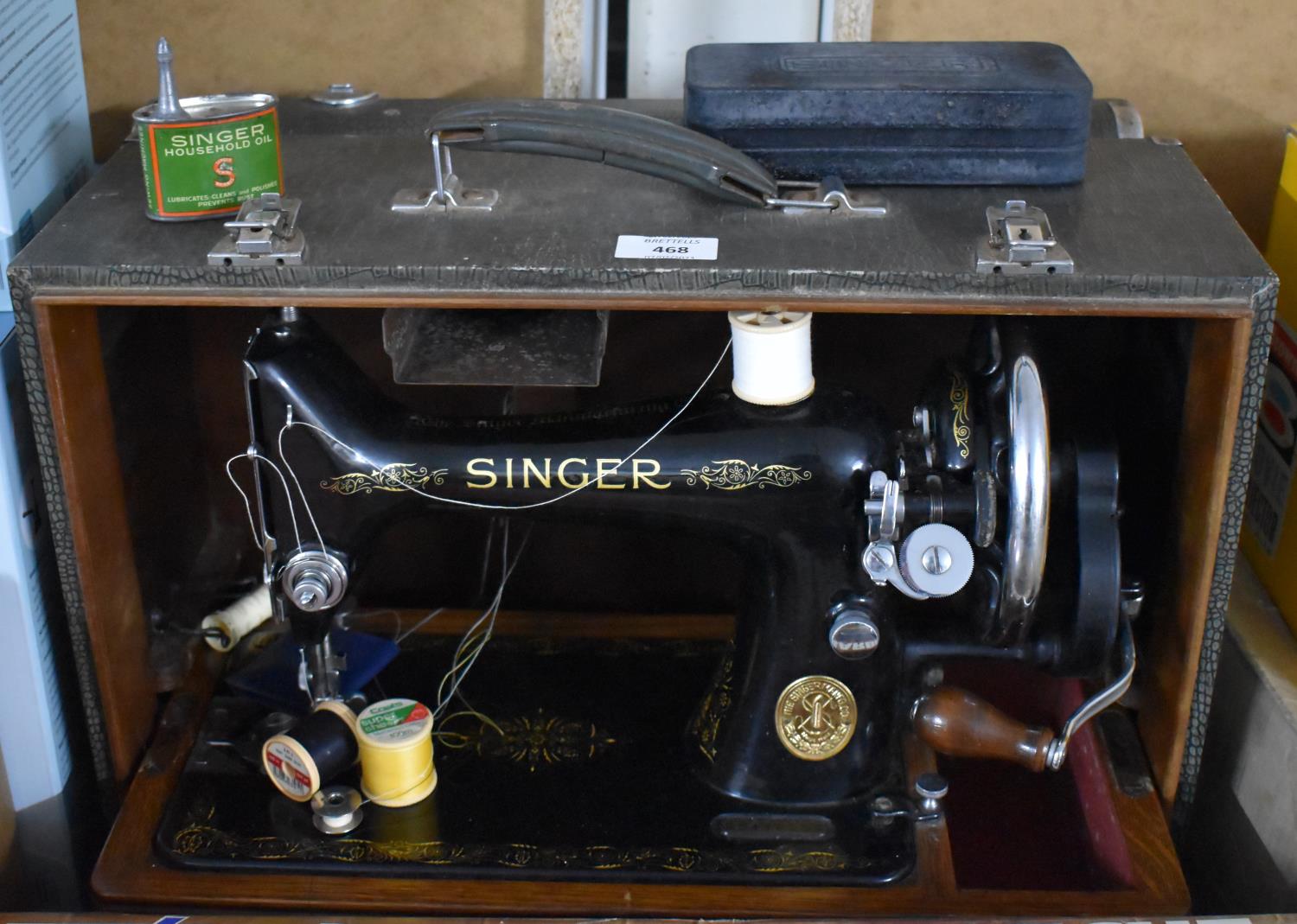 A Manual Singer Sewing Machine in Case with Accessories