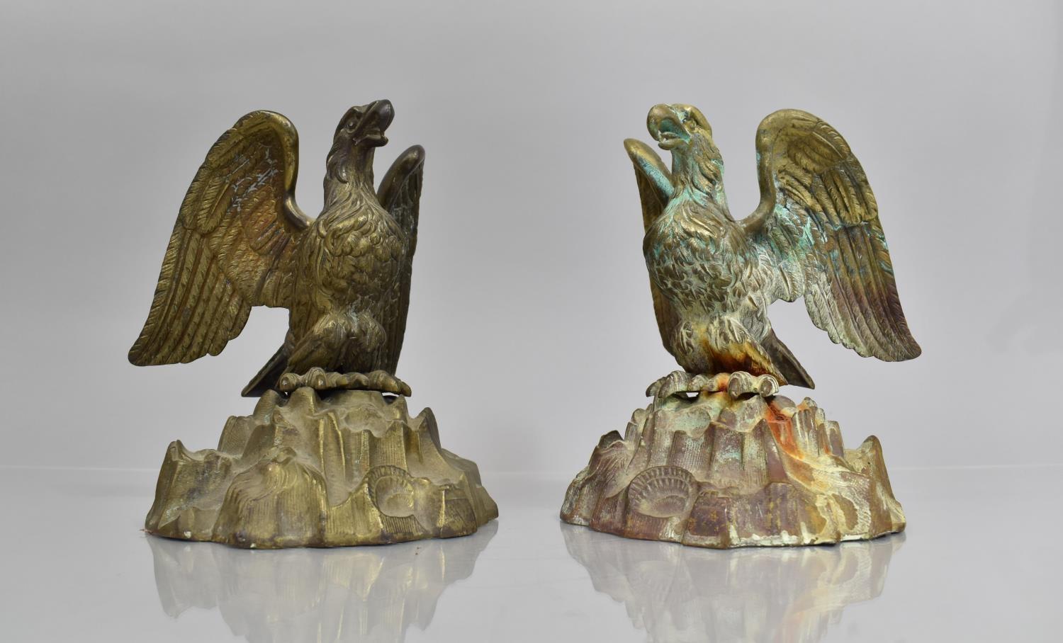 A Pair of Empire Style Verdigris Bronze Eagles Perched with Wings Aback on Naturalistic Rock Bases