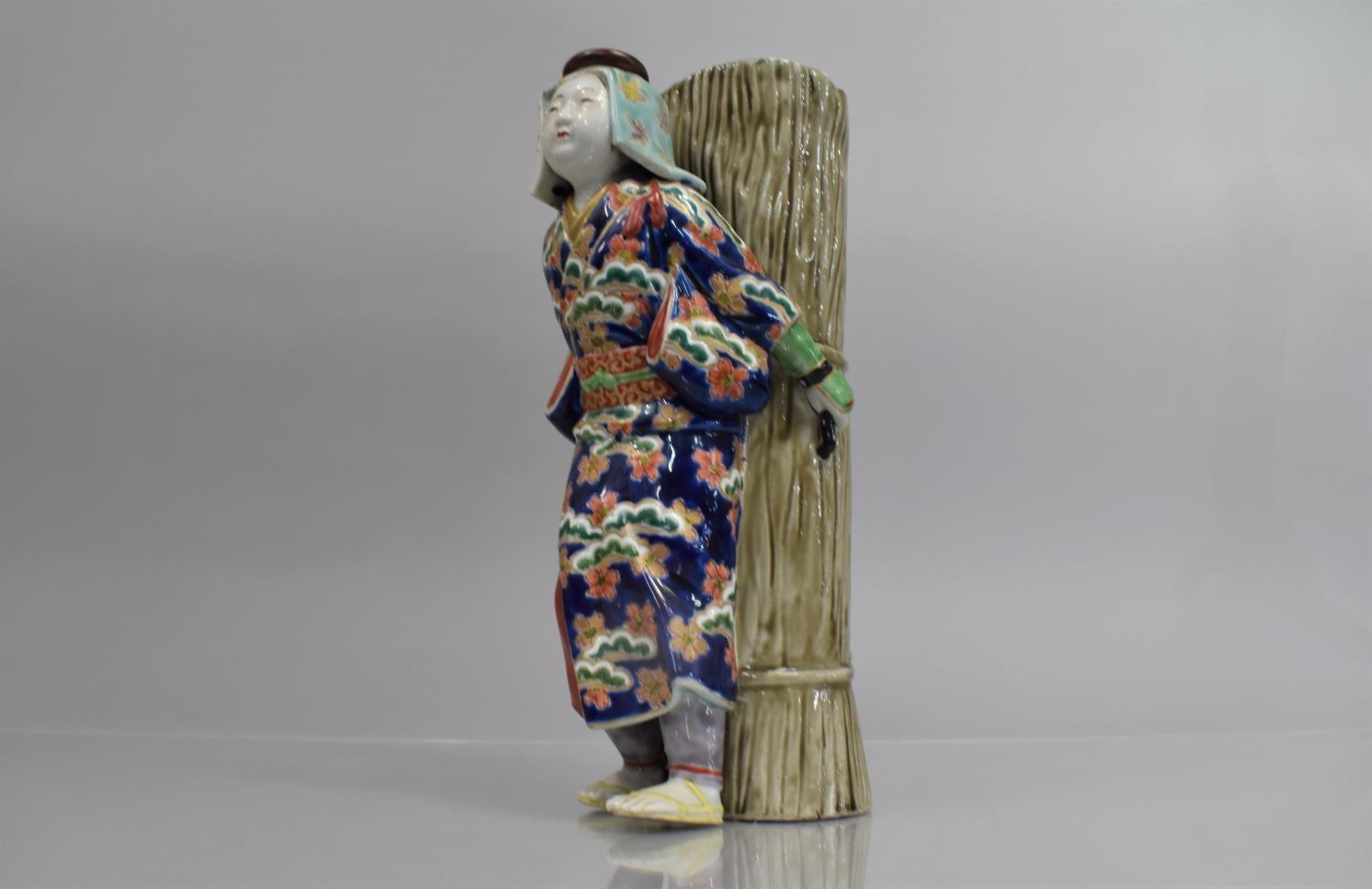 A Chinese Porcelain Figural Spill Vase Modelled as Chinese Lady Labourer Carrying Basket decorated