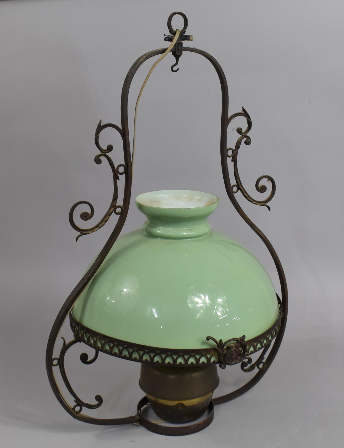 An Edwardian Brass Ceiling Hanging Oil Lamp now Converted to Electricity with Opaque Glass Shade