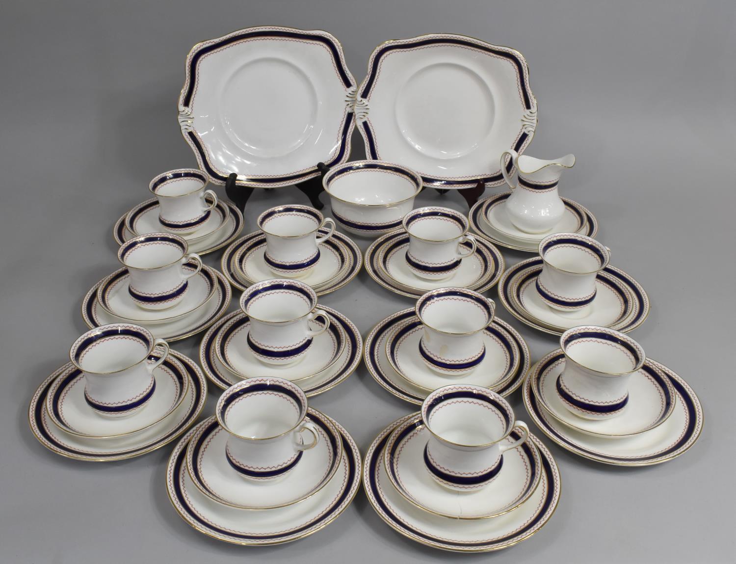 A Tuscan China Cobalt Blue and Geometric Trim Tea Set to comprise Cups, Saucers, Side Plates, Milk