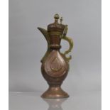 An Islamic Bukhara Copper and Brass Ewer, The Body of Vase Form, Supported on Circular Foot,