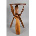 A Modern Souvenir African Circular Topped Occasional Table with Folding Legs, 36cms Diameter