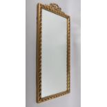 A Gilt Framed Mirror with Acorn Leaf Border andf Ribbon Finial, 70x33cm