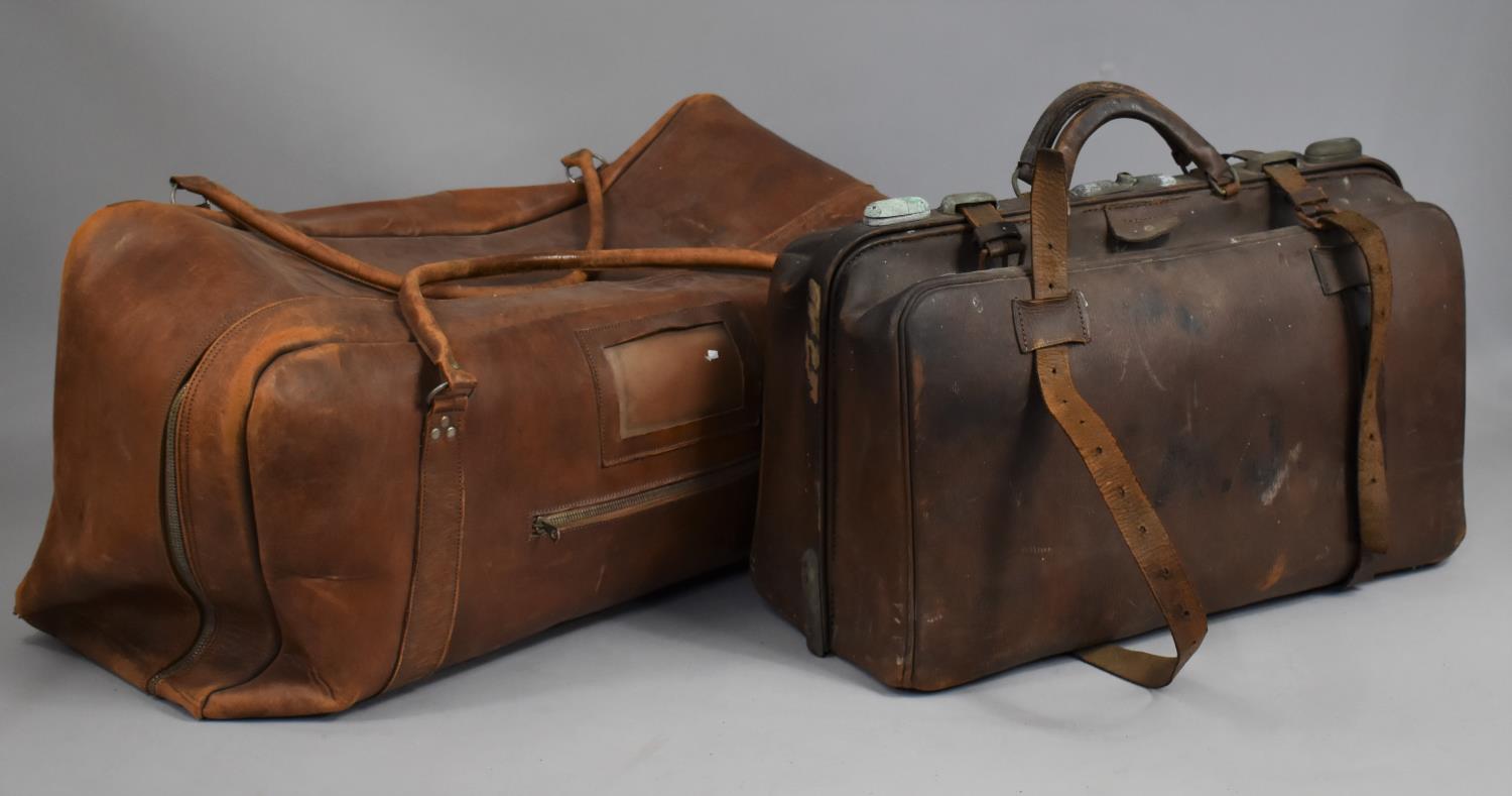 A Vintage Leather Overnight Bag together with a Vintage Gladstone Type Bag