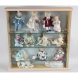 A Glazed Three Shelf Display Cabinet Containing Thirteen Ashton Drake Dolls, 55cm Square