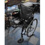 A Wheeltech Folding Wheelchair, Seat 56cms Wide