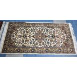 A Hand Made Sarough Patterned Rug, 140x70cms