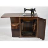 A Vintage Cased Singer Treadle Sewing Machine