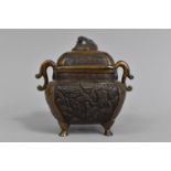 A Chinese Bronze Censer and Cover with Scrolled Handles Decorated with Scenes Depicting Chinese Gods