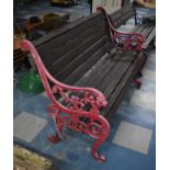 A Cast Iron and Wooden Slatted Garden Bench, Supports with Lion Mask and Scrolled Design, 125cms