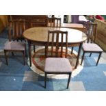 A 1970's Oak Extending Oval Dining Table Together with Four Chairs