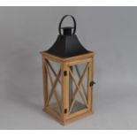 A Modern Metal Wooden Candle Lantern with Ring Carrying Handle, 51cms High