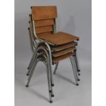 A Set of Four Stacking Childrens Chairs with Metal Frames