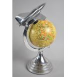A Novelty Desk Top Globe with Chromed Stand and Vintage Jet Flying Over the World, 31cms High