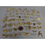 A Large Collection of Vintage and Contemporary Gilt Metal Brooches