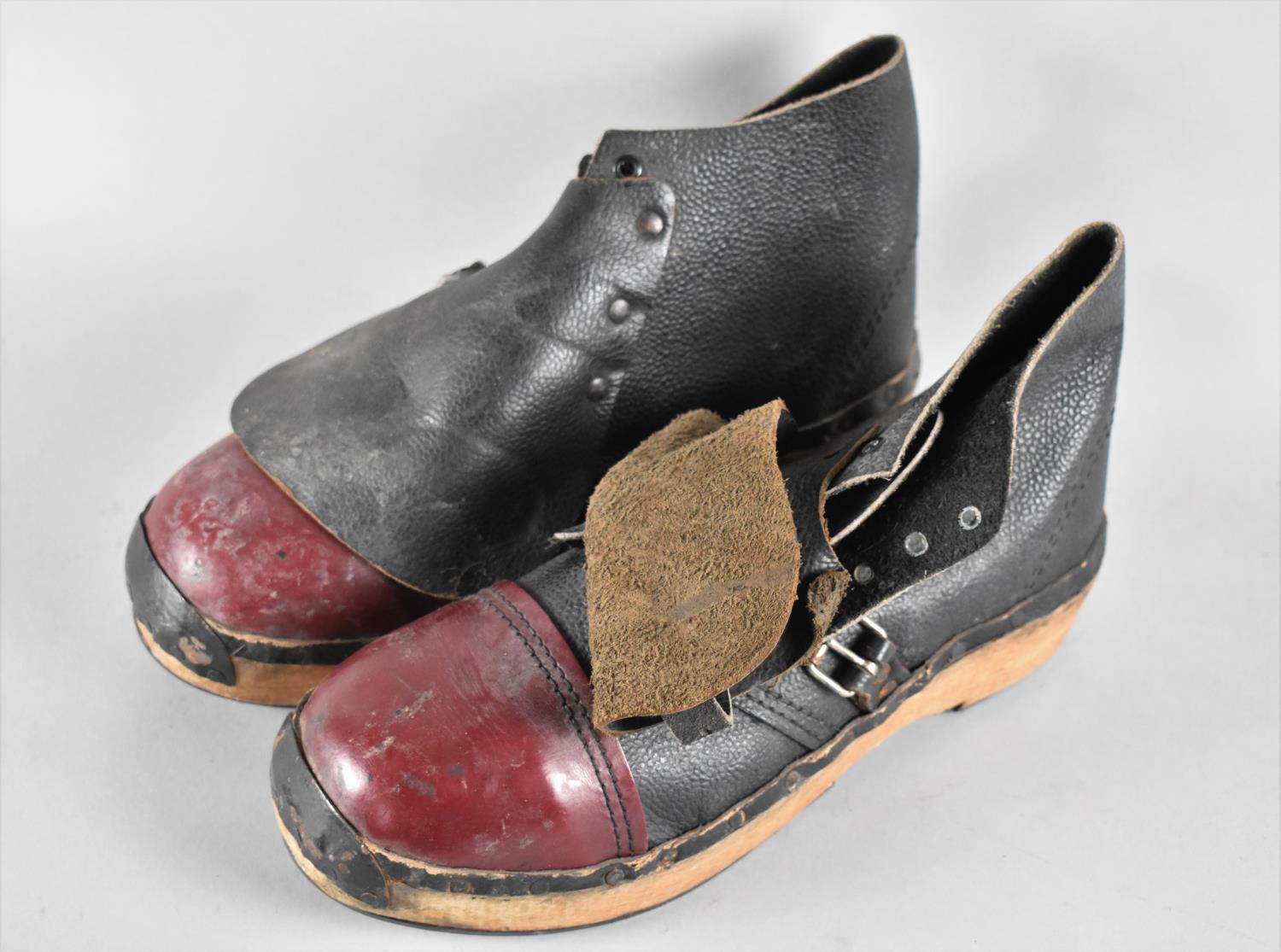 A Pair of Vintage Steel Capped Leather and Wooden Clogs