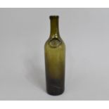 An Early Green Glass Hand Blown Wine Bottle, with Oval Mark S.S, 30cms High