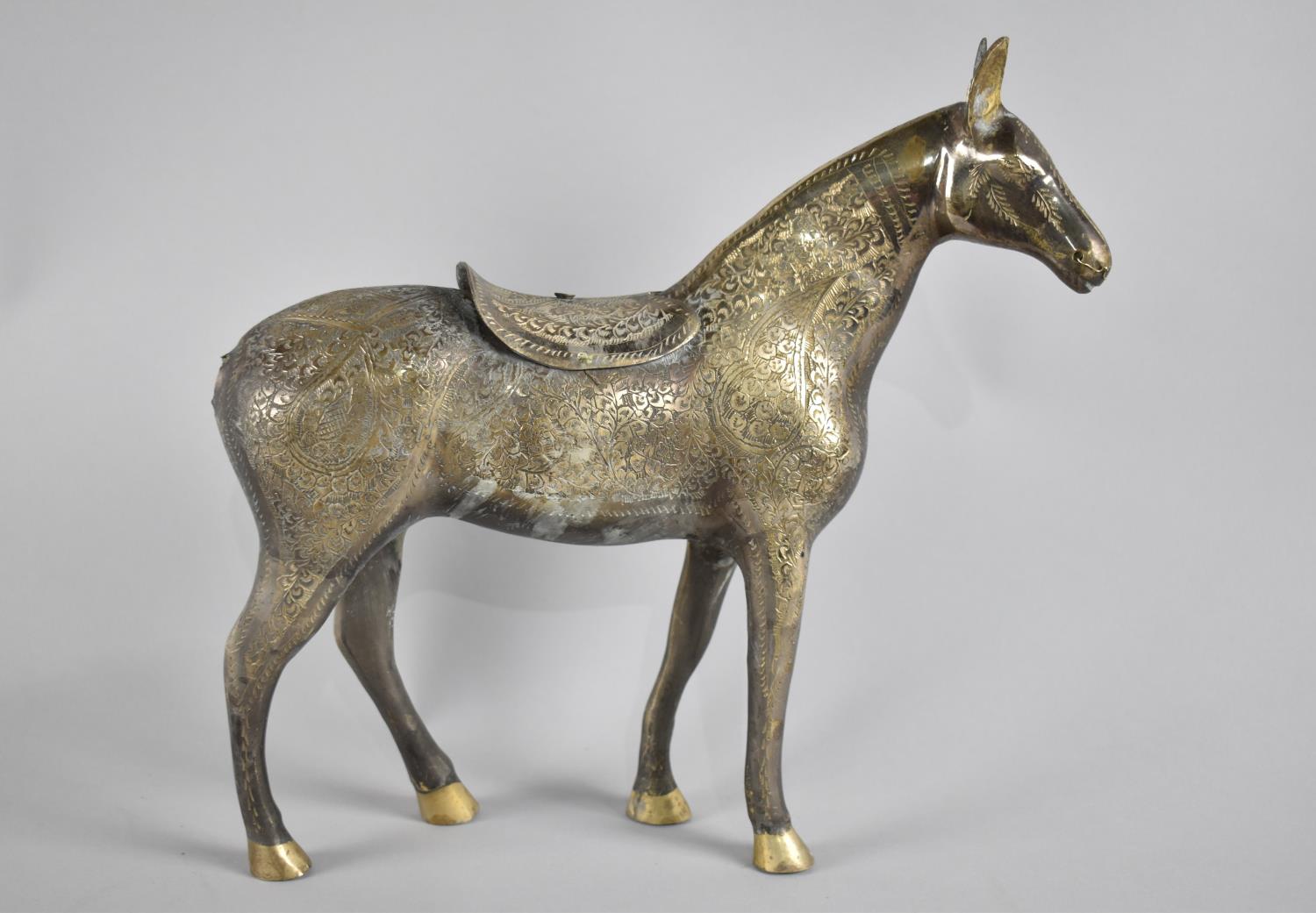 An Indian Silver Plated Study of a Horse having Engraved Decoration to Body and Saddle, 30cms High