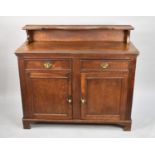 An Edwardian Oak Galleried Sideboard with Two Drawers Over Cupboard Base, Raised Display Shelf,