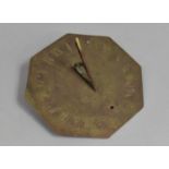 A Reproduction Octagonal Brass Sundial, Inscribed Tempus Fugit 1667, 20cms Diameter