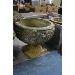 A Reconstituted Garden Planter of Urn Form with Moulded Bowl on Tapering Reeded Supports Culminating