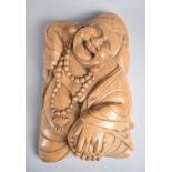 A Far Eastern Carved Wall Hanging Depicting Smiling Buddha, 27cms High