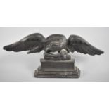 A Late Victorian Cast Metal Doorstop/Fireside Ornament in the Form of an Eagle with Snake,