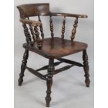 An Edwardian Elm Seated Smokers Bow Armchair