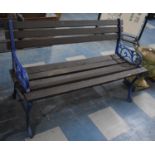A Cast Iron and Wooden Slatted Garden Bench, Supports of Pierced Scrolled Form, 119cms Wide