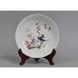 A 19th Century Chinese Porcelain Dish Decorated in the Famille Rose Palette with Birds in Blossoming