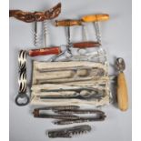 A Collection of Various Corkscrews, Nutcrackers, Scissors, Bottle Opener