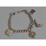 A Late 19th/Early 20th Century Silver Curb Chain with Albert Clasp Having Four Silver Charms to