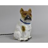 An Early 20th Century Continental Porcelain Novelty Table Lamp in the Form of a Seated Pug Dog, 15.