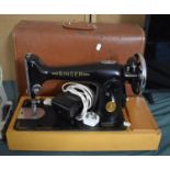 A Singer Electric Sewing Machine with Pedal, Untested