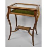 An Edwardian Bijouterie Table on Extended Cabriole Supports, Stretcher Shelf and with Hinged Lid,